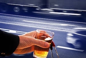 Man Holding Glass of Alcohol and Keys